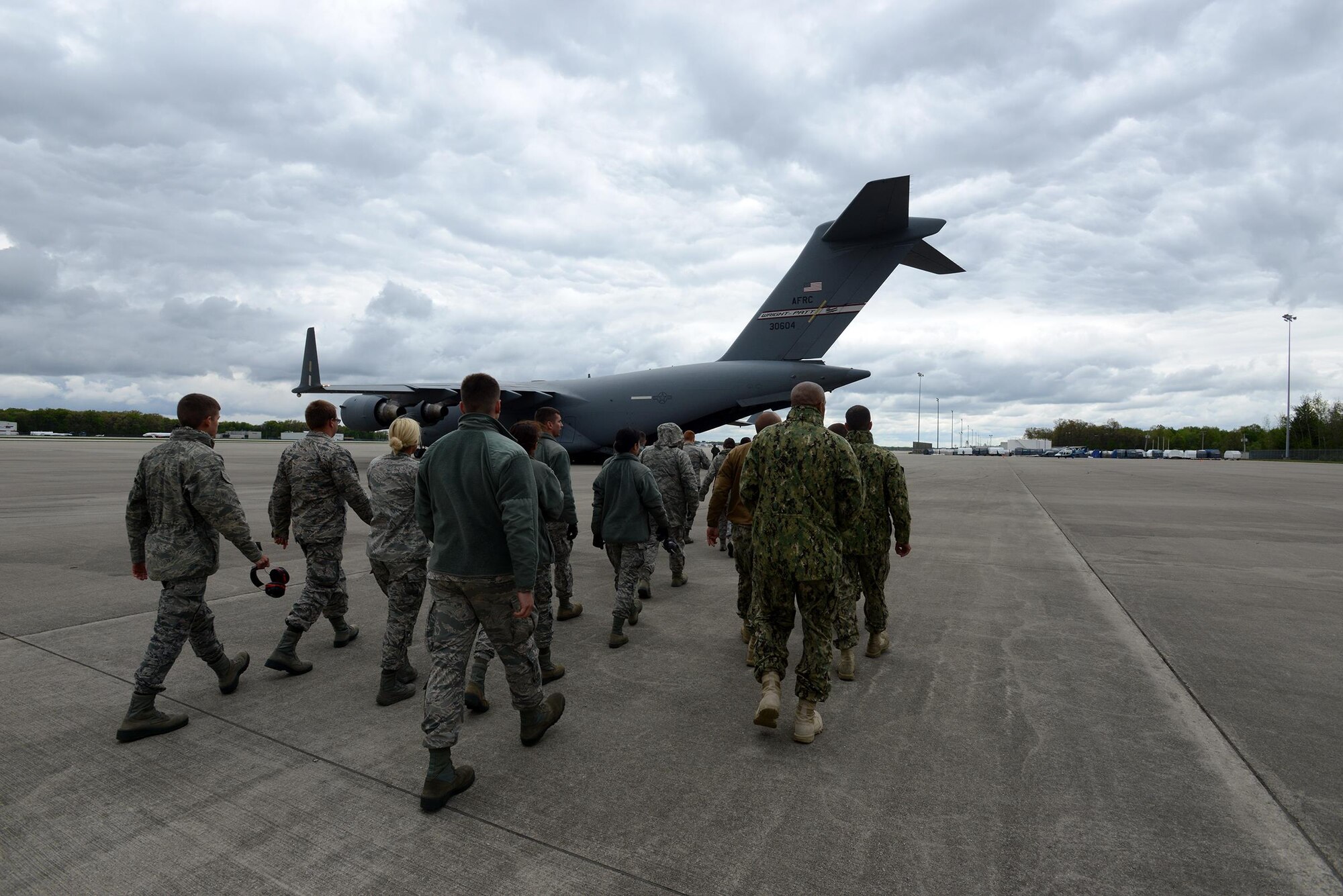 The 180th Fighter Wing hosts joint cargo load training at Toledo Air National Guard Base May 14, 2016. Participating in the five-day training exercise were 34 organizations from 13 states, including 43 Airmen from the 445th Airlift Wing. 445 AW Airmen included 15 loadmasters, 15 445th Aeromedical Evacuation Squadron members, eight 87th Aerial Port Squadron Airmen, two pilots from the 89th Airlift Squadron and two crew chiefs from the 445th Aircraft Maintenance Squadron  (U.S. Coast Guard Photo by Petty Officer 3rd Class Joel Altman)