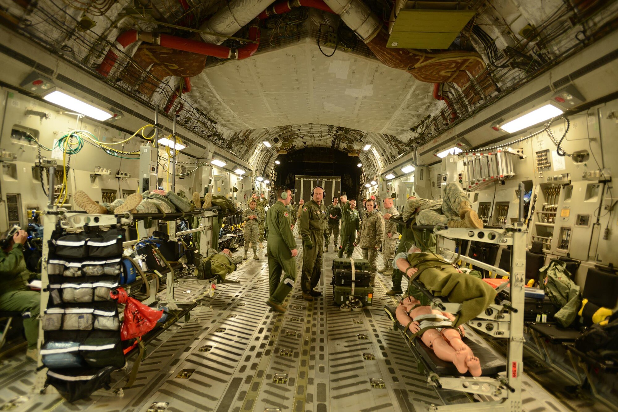 The 180th Fighter Wing hosts joint cargo load training at Toledo Air National Guard Base May 14, 2016. Participating in the five-day training exercise were 34 organizations from 13 states, including 43 Airmen from the 445th Airlift Wing. 445 AW Airmen included 15 loadmasters, 15 445th Aeromedical Evacuation Squadron members, eight 87th Aerial Port Squadron Airmen, two pilots from the 89th Airlift Squadron and two crew chiefs from the 445th Aircraft Maintenance Squadron  (U.S. Coast Guard Photo by Petty Officer 3rd Class Joel Altman)