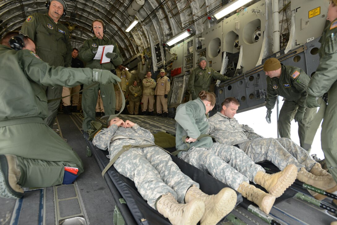 The 180th Fighter Wing hosts joint cargo load training at Toledo Air National Guard Base May 14, 2016. Participating in the five-day training exercise were 34 organizations from 13 states, including 43 Airmen from the 445th Airlift Wing. 445 AW Airmen included 15 loadmasters, 15 445th Aeromedical Evacuation Squadron members, eight 87th Aerial Port Squadron Airmen, two pilots from the 89th Airlift Squadron and two crew chiefs from the 445th Aircraft Maintenance Squadron  (U.S. Coast Guard Photo by Petty Officer 3rd Class Joel Altman)