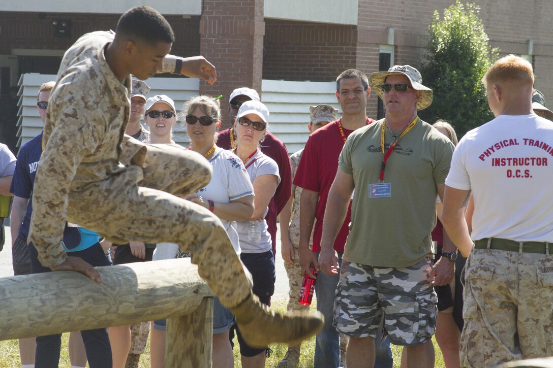 Marines demonstrate the obstacle course candidates must pass to become Marine officers for approximately 40 educators from states east of the Mississippi River aboard Marine Corps Base Quantico, Va., June 7. The 2016 Key Leaders and Educators Workshop takes place June 6-10, and helps build meaningful and purposeful relationships with those that have the privilege to guide America's leaders of tomorrow. Educators will participate in events such as infantry patrolling, flight simulations and many others.