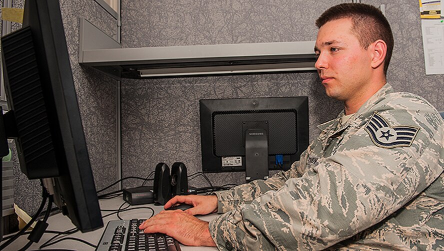 Staff Sgt. Yevgeniy, National Air and Space Intelligence Center, prepares documents for a presentation here, May 10, 2016. Leaders at the Air Force District of Washington recently recognized Staff Sgt. Yevgeniy as one of their command level 12 Outstanding Airmen of the Year for his outstanding performance in the intelligence, surveillance, and reconnaissance field. (U.S. Air Force photo by Tech. Sgt. Eunique P. Thomas)