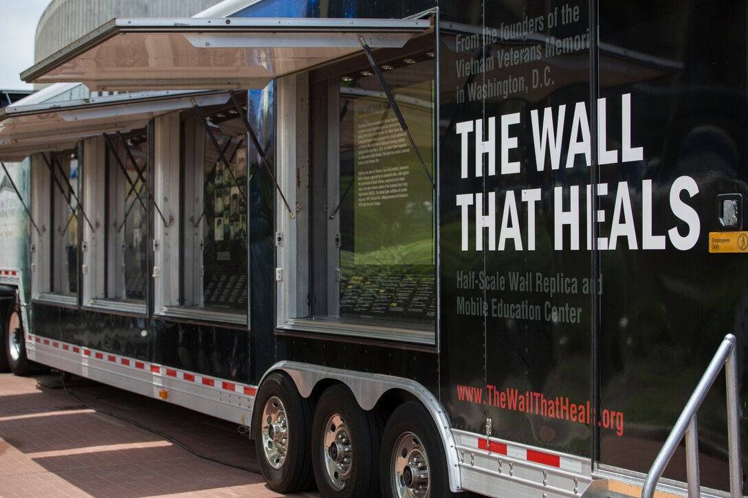 VIRGINIA BEACH, Va. - The Wall That Heals, a half replica of the Vietnam Memorial in Washington D.C., stops in Virginia Beach, June 3-5. Marines and sailors volunteered to help people locate names of their loved ones on the wall. The traveling exhibit provides thousands of veterans who have been unable to cope with the prospect of facing The Wall to find the strength and courage tk do so within their own communities, thus allowing the healing process to begin. (U.S. Marine Corps photo by Cpl. Logan Snyder)