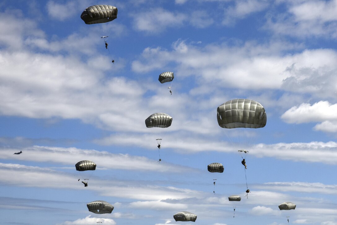 Paratroopers complete an airborne operation as part of Exercise Anakonda 2016 in Drawsko Pomorskie, Poland, June 6, 2016. The Polish-led, multinational exercise runs from June 7-17, and involves more than 25,000 participants from more than 20 nations. The paratroopers are soldiers assigned to the 173rd Airborne Brigade. Army photo by Sgt. 1st Class Whitney Hughes