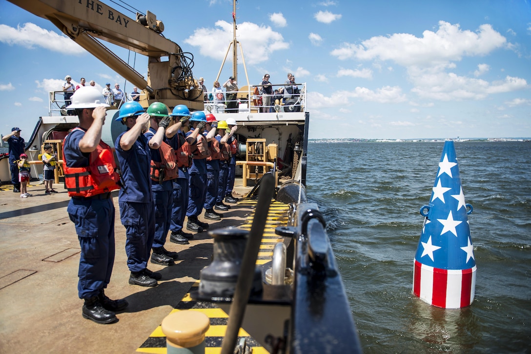 Crew members aboard U.S. Coast Guard Cutter James Rankin, a 175-foot buoy tender, salute after setting the Francis Scott Key buoy in Baltimore, Md., June 6, 2016. The buoy marks the spot where the ship carrying Francis Scott Key, the author of "The Star-Spangled Banner," was anchored off Fort McHenry during the War of 1812. Coast Guard photo by Petty Officer 3rd Class Jasmine Mieszala