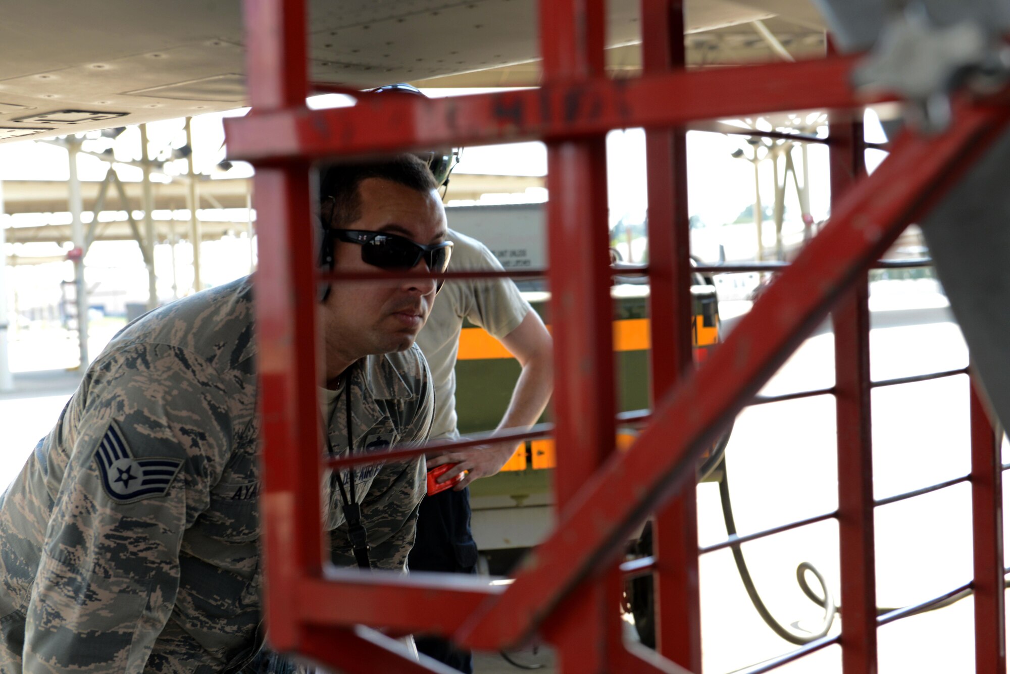 U.S. Air Force Staff Sgt. Edgar Ayala, 20th Maintenance Group quality assurance inspector, inspects the intake of an F-16CM Fighting Falcon at Shaw Air Force Base, S.C., June 2, 2016. During an inspection, 20th MXG QA looks for housekeeping and safety violations as well as ensure maintenance was performed correctly. (U.S. Air Force photo by Airman 1st Class Destinee Dougherty)