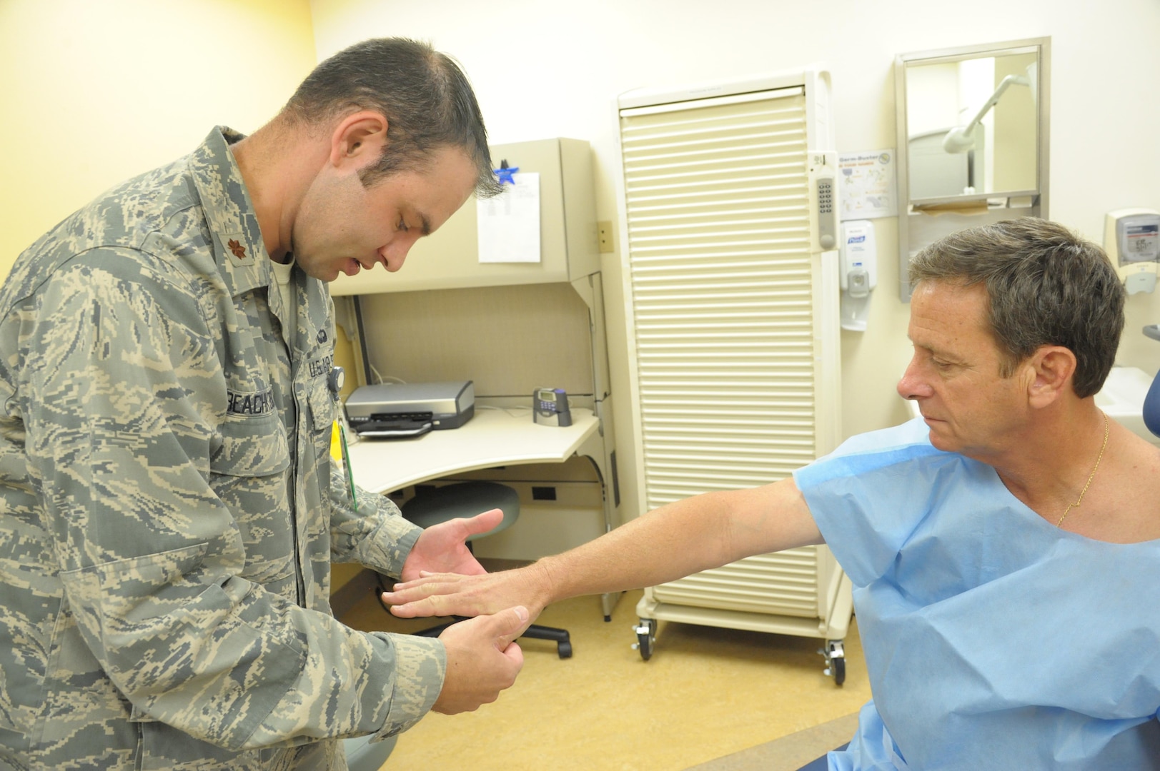 Maj. (Dr.) Thomas Beachkofsky, 59th Medical Specialty Squadron dermatologist, checks a patient for abnormal skin growths Tuesday at the Joint Base San Antonio-Randolph Medical Clinic.The 59th Medical Wing at Joint Base San Antonio-Lackland has expanded dermatology services to the JBSA-Randolph Medical Clinic, Beachkofsky, started seeing patients May 17 at the 359th Medical Group facility on Third Street West.
