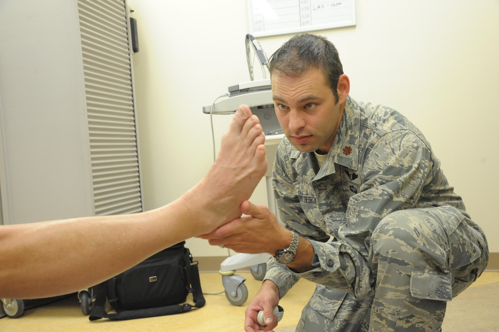 Maj. (Dr.) Thomas Beachkofsky, 59th Medical Specialty Squadron dermatologist, checks a patient for abnormal skin growths Tuesday at the Joint Base San Antonio-Randolph Medical Clinic.The 59th Medical Wing at Joint Base San Antonio-Lackland has expanded dermatology services to the JBSA-Randolph Medical Clinic, Beachkofsky, started seeing patients May 17 at the 359th Medical Group facility on Third Street West.

