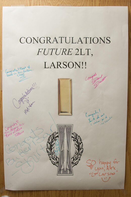 A congratulatory poster hangs on the door  of Staff Sgt. Alex Larson’s office, 90th Medical Operations Squadron flight and operations medicine technician, June 1, 2016, in the medical treatment facility at F.E. Warren Air Force Base, Wyo. Larson was selected to become an officer in his first-choice career field of nuclear missile operations. (U.S. Air Force photo by Senior Airman Jason Wiese)