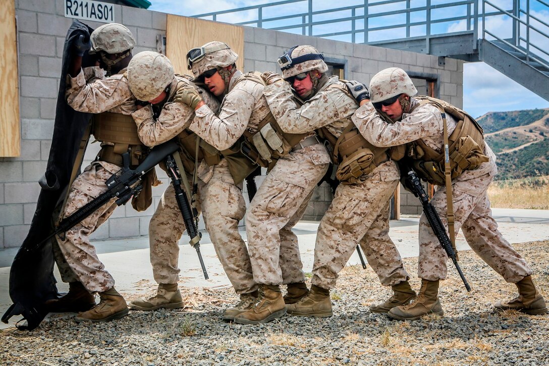 U.S. Marines with the 7th Engineer Support Battalion, 1st Marine Logistics Group, go through mock breaching’s as part of group training. The training includes working with simulated explosives as well as breaching doors and windows on range 211A, Camp Pendleton, Calif., May 25, 2016. (U.S. Marine Corps photo by LCpl. Salmineo Sherman Jr. Combat Camera/released)
