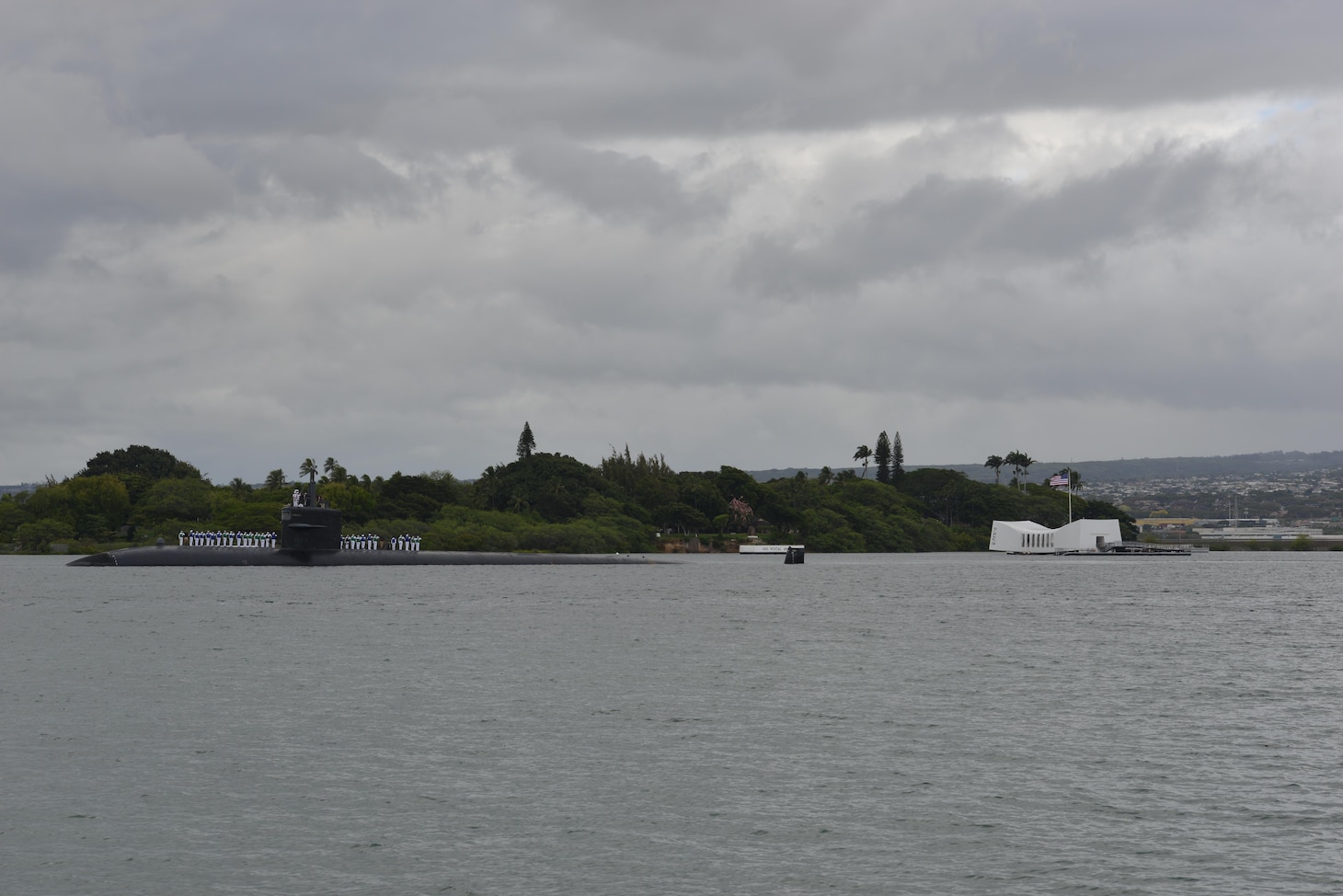160606-N-LY160-088
PEARL HARBOR (June 6, 2016) Sailors, assigned to the Los Angeles-class fast-attack submarine USS Houston (SSN 713),  render honors to the USS Arizona Memorial as the ship departs Joint Base Pearl Harbor-Hickam for the final time, June 6. Houston is en route to Puget Sound Naval Shipyard in Bremerton, Washington, to commence its inactivation process and decommissioning after 33 years of service. (U.S. Navy photo by Mass Communication Specialist 2nd Class Michael H. Lee/Released)