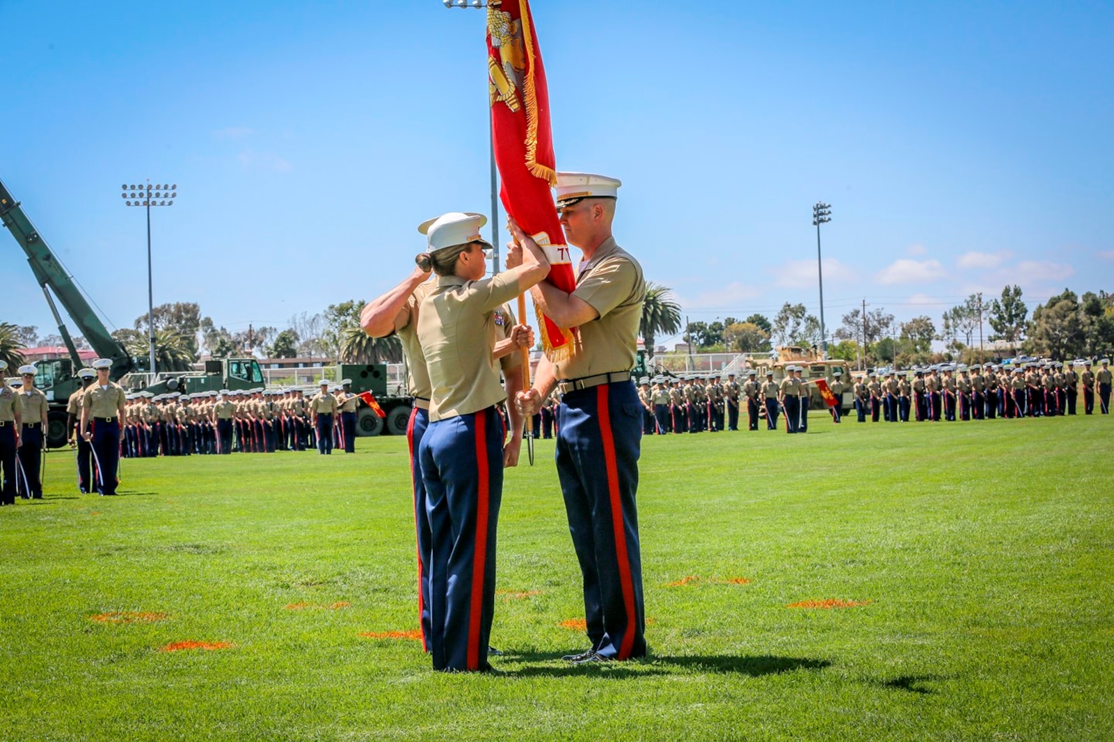U.S. Marine Lt. Col. Jennifer A. Nash receives the unit colors from Lt. Col. Eric J. Penrod with 7th Engineer Support Battalion (ESB) 1st Marine Logistics Group. The change of command for 7th ESB, May 26th 2016, Camp Pendleton, Calif., represents a military tradition that represents the transfer of authority and responsibility of a unit from one commanding officer to another. (U.S. Marine Corps photo by LCpl. Salmineo Sherman Jr. 1st MLG Combat Camera/released)