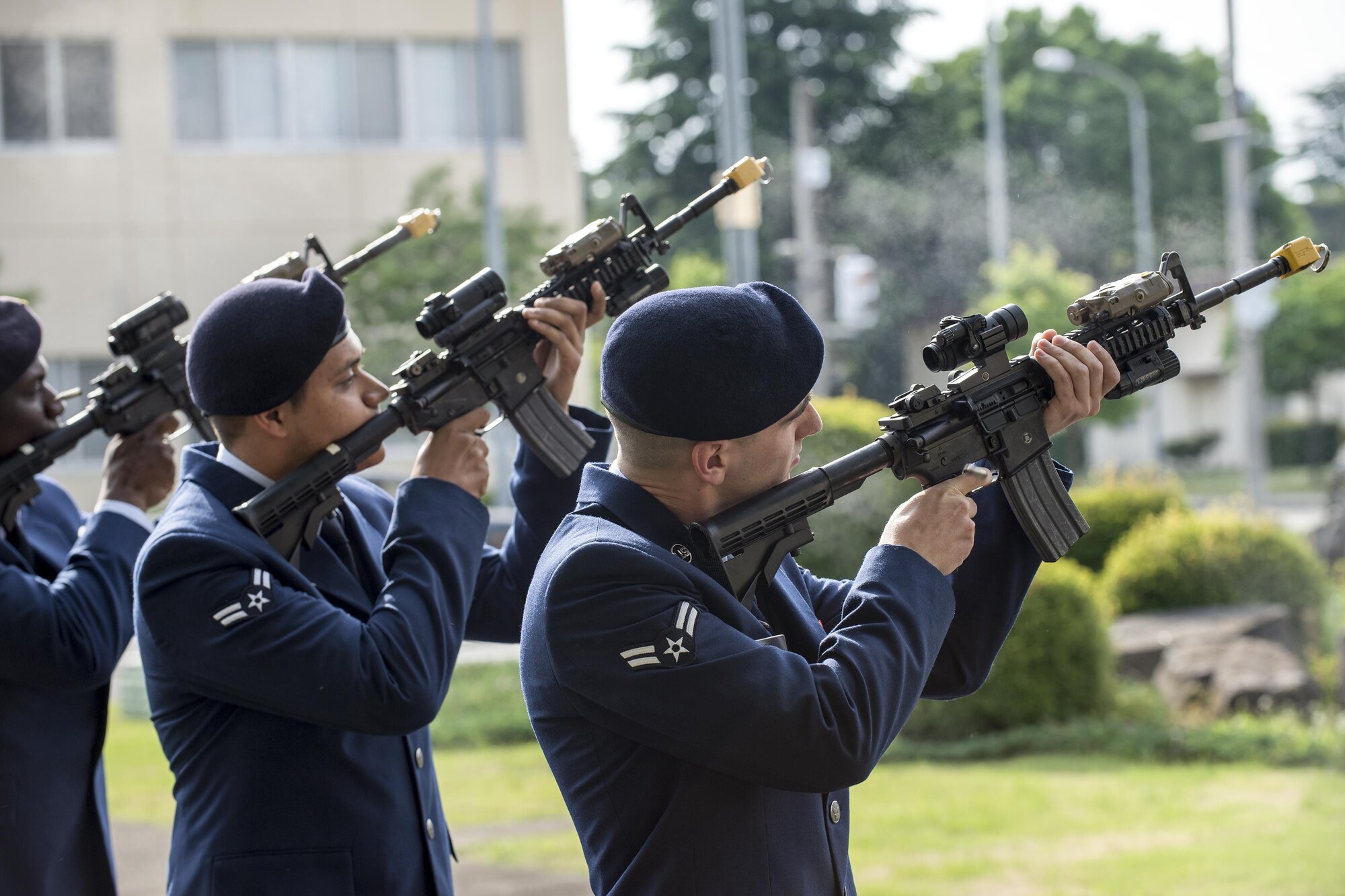 Defenders with the 374th Security Forces Squadron perform the gun salute during a retreat ceremony May 19, 2016 at Yokota Air Base, Japan. The security forces-lead ceremony wrapped up the squadron’s National Police Week activities while also, Yokota mourning their fallen Military Working Dog Alan/L220 recently passed away from cancer. (U.S. Air Force photo by Yasuo Osakabe/Released)