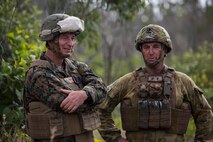 U.S. Marine Corps Sgt. Maj. Stuart D. Glass, Sergeant Major of 1st Battalion, 1st Marine Regiment, and members of the Australian Army with Battle Group Waratah, 8th Brigade, spectate Marines performing platoon live fire at Shoalwater Bay, Queensland, Australia, May 22, 2016. The platoon-level live fire and maneuver was part of Exercise Southern Jackaroo, a combined training opportunity during Marine Rotational Force – Darwin (MRF-D). MRF-D is a six-month deployment of Marines into Darwin, Australia, where they will conduct exercises and train with the Australian Defence Forces, strengthening the U.S.-Australia alliance.