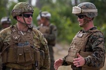 U.S. Marine Corps Lt. Col. Steven Sutey, Commanding Officer of 1st Battalion, 1st Marine Regiment, and members of the Australian Army with Battle Group Waratah, 8th Brigade, spectate Marines performing  platoon live fire in Shoalwater Bay, Queensland, Australia, May 22, 2016. The platoon-level live fire and maneuver was part of Exercise Southern Jackaroo, a combined training opportunity during Marine Rotational Force – Darwin (MRF-D). MRF-D is a six-month deployment of Marines into Darwin, Australia, where they will conduct exercises and train with the Australian Defence Forces, strengthening the U.S.-Australia alliance.