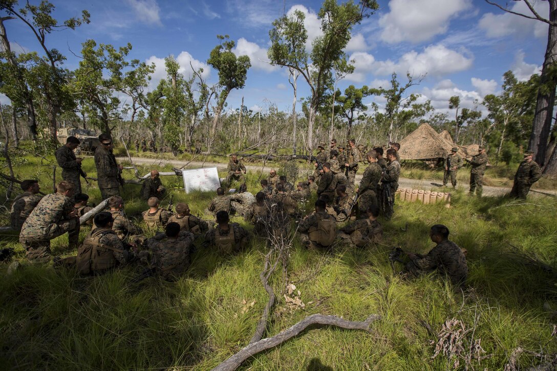 U.S. Marine Corps Capt. Chris Brock, Commanding Officer of Company A, 1st Battalion, 1st Marine Regiment, debriefs the Marines after performing platoon live fire at Shoalwater Bay, Queensland, Australia, May 22, 2016. The platoon-level live fire and maneuver was part of Exercise Southern Jackaroo, a combined training opportunity during Marine Rotational Force – Darwin (MRF-D). MRF-D is a six-month deployment of Marines into Darwin, Australia, where they will conduct exercises and train with the Australian Defence Forces, strengthening the U.S.-Australia alliance. 