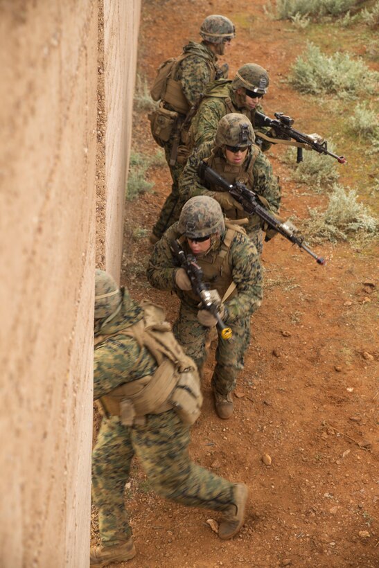 Marines with Company C, 1st Battalion, 1st Marine Regiment, clear a building during Exercise Predator Strike at Cultana Training Area, South Australia, Australia, June 5, 2016. Predator Strike, a yearly exercise taken place in Australia with Marine Rotational Force – Darwin, allows Marines to enhance their skills and train with the Australian Defence Force.
