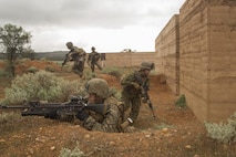 Marines with Company C, 1st Battalion, 1st Marine Regiment, move from building to building to clear them during Exercise Predator Strike at Cultana Training Area, South Australia, Australia, June 5, 2016. Predator Strike, a yearly exercise taken place in Australia with Marine Rotational Force – Darwin, allows Marines to enhance their skills and train with the Australian Defence Force.
