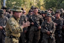 Lt. Col. Jim McGann, Commanding Officer of Battle Group Waratah, 8th Brigade, thanks U.S. Marines, members of the Australian Army, and members of the Japan Ground Self-Defense Force, for their training during Exercise Southern Jackaroo at Shoalwater Bay, Queensland, Australia, May 26, 2016. Exercise Southern Jackaroo allowed combined military services to train together and learn from each other during Marine Rotational Force – Darwin (MRF-D). MRF-D is a six-month deployment of Marines into Darwin, Australia, where they will conduct exercises and train with the Australian Defence Forces, strengthening the U.S.-Australia alliance. The Marines are with 1st Battalion, 1st Marine Regiment, MRF-D. The Australians soldiers are with Battle Group Waratah, 8th Brigade.