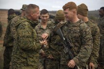U.S. Navy Lt. Michael S. Kennedy, Marine Rotational Force – Darwin Chaplain, serves communion to Lance Cpl. John Larue, a rifleman, at the Company C bivouac in Cultana Training Area, South Australia, Australia, June 5, 2016. Military chaplains serve all spiritual needs and ensure service members are afforded the opportunity to practice their religion freely. Kennedy is from Huntsville, Alabama. Larue, from Lenexa, Kansas, is with Weapons Platoon, Company C, 1st Battalion, 1st Marine Regiment.