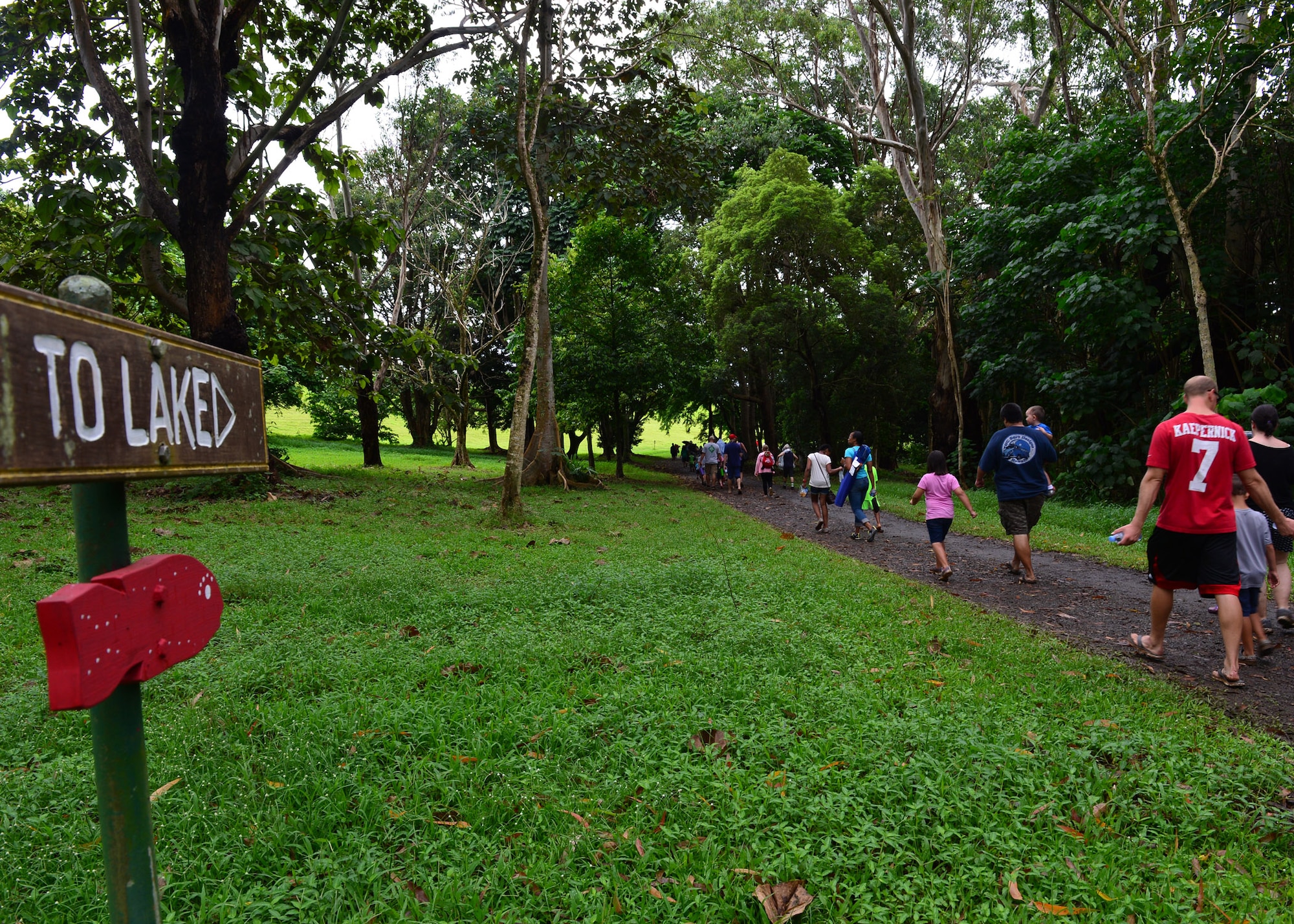 Airmen and their family members walk to the fishing ground for the annual Friends of Hickam Keiki Fishing Tournament at the Ho`omaluhia Botanical Gardens in Kaneohe, Hawaii, June 2, 2016. More than 150 children and their parents from Joint Base Pearl Harbor-Hickam attended the fishing tournament in its 17th year. The Friends of Hickam is a non-profit organization composed of civic and business leaders in the local community who are interested in showing support for the Air Force in Hawaii. (U.S. Air Force photo by Tech. Sgt. Aaron Oelrich/Released)  