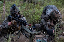 Lance Cpl. Ryan Irmiter, left, automatic rifleman, provides security for Lance Cpl. Johnny Sinclhir, right, while digging into their defensive positions during Exercise Southern Jackaroo at Shoalwater Bay, Queensland, Australia, May 18, 2016. Conducting defensive training allows U.S. Marines and Australian service members to share techniques, tactics and procedures to improve their defensive skills during Marine Rotational Force – Darwin (MRF-D). MRF-D is a six-month deployment of Marines into Darwin, Australia, where they will conduct exercises and train with the Australian Defence Forces, strengthening the U.S.-Australia alliance.