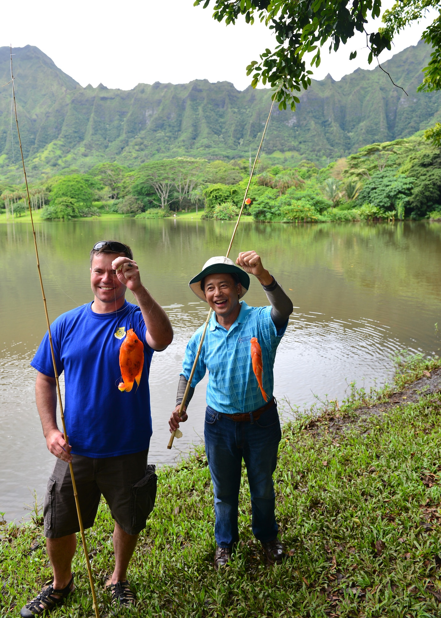 Col. Cavan Craddock, vice commander 15th Wing, and James Tam, Friends of Hickam president, marked the official start of the Friends of Hickam Keiki Fishing Tournament at the Ho`omaluhia Botanical Gardens in Kaneohe, Hawaii, June 2, 2016. More than 150 Airmen and their children from Joint Base Pearl Harbor-Hickam attended the fishing tournament in its 17th year. The Friends of Hickam is a non-profit organization composed of civic and business leaders in the local community who are interested in showing support for the Air Force in Hawaii. (U.S. Air Force photo by Tech. Sgt. Aaron Oelrich/Released
