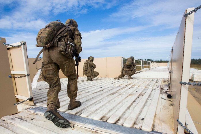 Members of the Australian Army with Battle Group Waratah, 8th Brigade, run to a defensive position during urban warfare training at Shoalwater Bay, Queensland, Australia, May 24, 2016. The urban warfare training, part of Exercise Southern Jackaroo, allowed combined military forces to train, teach, and learn from each other in an urban environment during Marine Rotational Force – Darwin (MRF-D). MRF-D is a six-month deployment of Marines into Darwin, Australia, where they will conduct exercises and train with the Australian Defence Forces, strengthening the U.S.-Australia alliance.