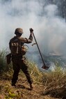 U.S. Marines put out a fire during a simulated attack at Shoalwater Bay, Queensland, Australia, May 29, 2016. The simulated attack, part of Exercise Southern Jackaroo, increased proficiency in defensive actions against an oncoming enemy force during Marine Rotational Force – Darwin (MRF-D). MRF-D is a six-month deployment of Marines into Darwin, Australia, where they will conduct exercises and train with the Australian Defence Forces, strengthening the U.S.-Australia alliance. The Marines are with 1st Battalion, 1st Marine Regiment, MRF-D. 