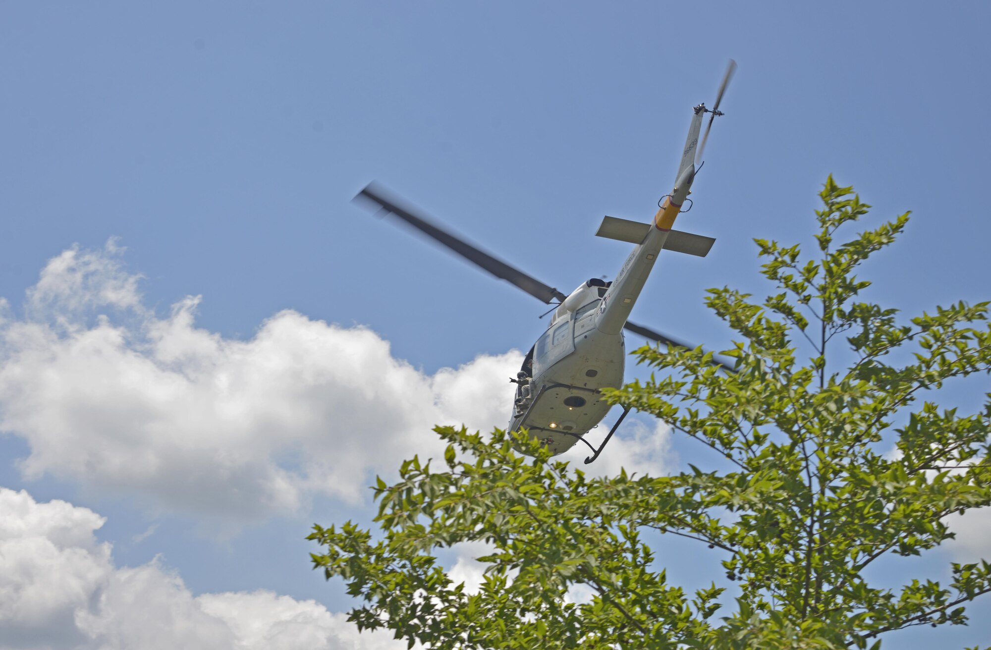 A UH-1N Iroquois with the 459th Airlift Squadron takes off from a drop zone near Mt. Fuji, Japan, June 3, 2016. The formation flight provided the aircrew with an opportunity to practice flight procedures and prepare for real-world missions. (U.S. Air Force photo by Senior Airman David Owsianka/Released)