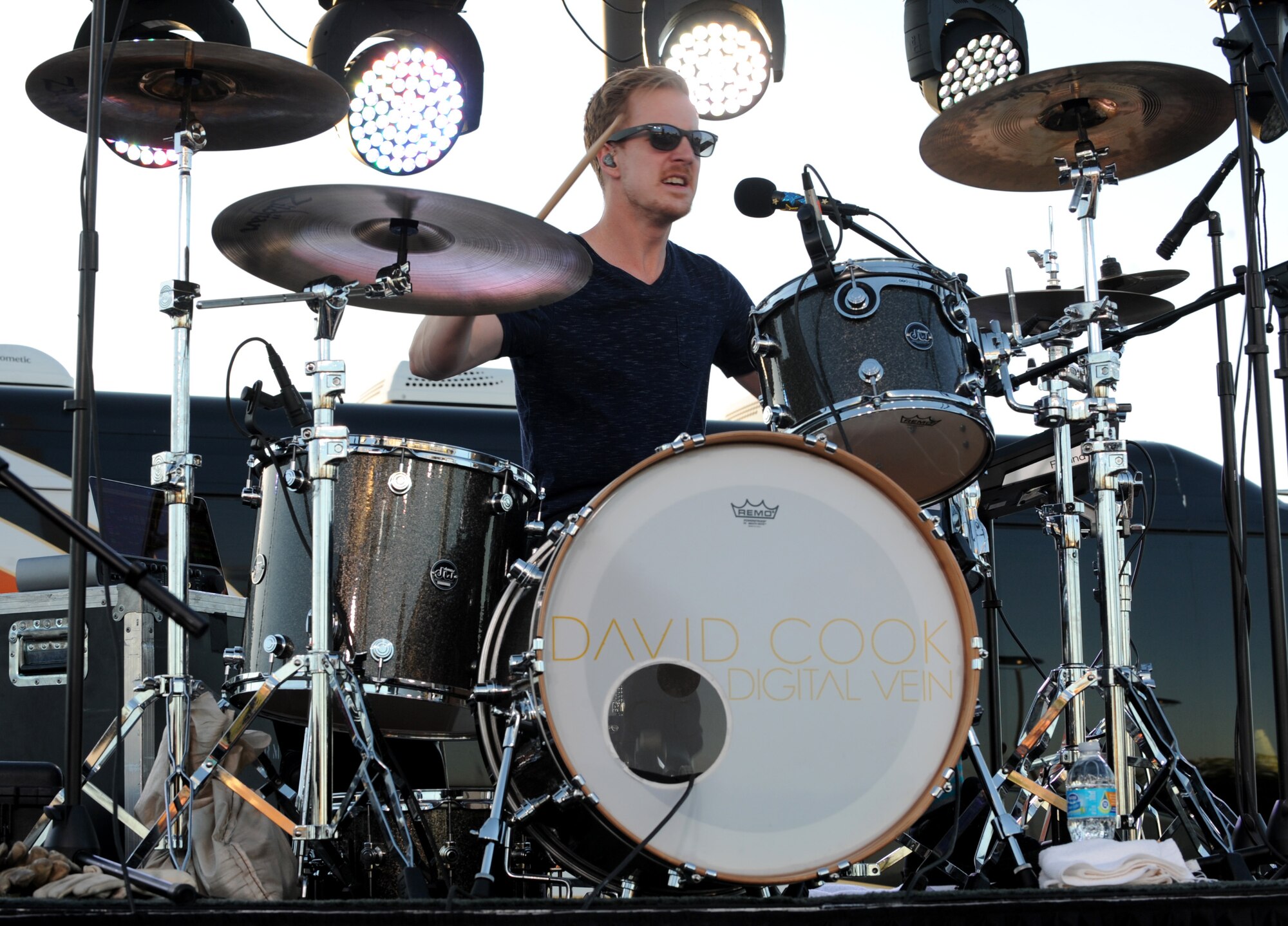 Nick Adams, drummer for David Cook, performs a solo during a free concert for Airmen and their families outside the Dakota’s Club at Ellsworth Air Force Base, S.D., June 3, 2016. As part of the Air Force Services Activities entertainment program, Cook and his band will be performing at 16 U.S. Air Force installations this year. (U.S. Air Force photo by Airman 1st Class Denise M. Nevins/Released)