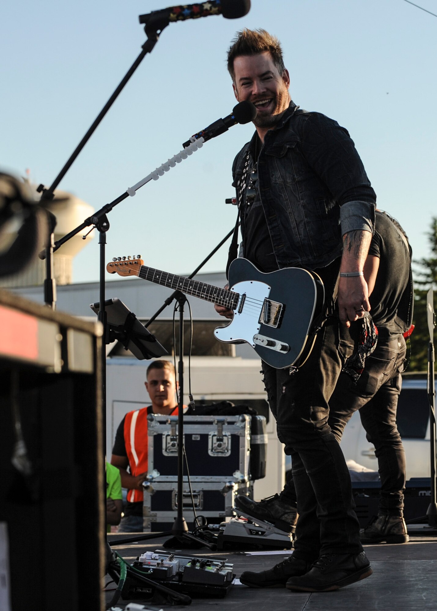 David Cook, winner of season seven of “American Idol,” addresses the audience during a free concert outside the Dakota’s Club at Ellsworth Air Force Base, S.D., June 3, 2016. Cook has performed for U.S. military personnel in Bahrain, Iran, Iraq, Kuwait, the Persian Gulf and across Europe. (U.S. Air Force photo by Airman 1st Class Denise M. Nevins/Released)