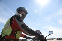 Senior Master Sgt. Gordon Comerford, 28th Munitions Squadron flight chief and rider course instructor, revs his motorcycle while wearing the proper personal equipment during a basic riders’ course at Ellsworth Air Force Base, S.D., May 19, 2016.The proper personal equipment required for riders on Ellsworth are a Department of Transportation approved helmet, eye protection, long-sleeves, full-fingered gloves, pants and sturdy over the ankle footwear. (U.S. Air Force photo by Airman 1st Class Sadie Colbert/Released)