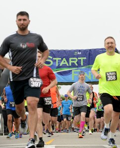 Participants run from the starting line of the 3rd annual NASA Langley Research Center Moonwalk and Run 5K at NASA LaRC, Va., June 4, 2016. More than 600 runners and walkers from the Hampton Roads community participated in the event. (U.S. Air Force photo by Staff Sgt. Teresa J. Cleveland)