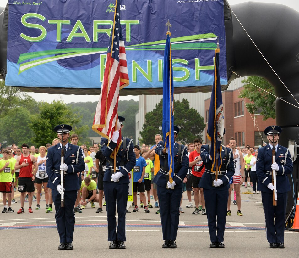 Members of the Langley Honor Guard present the colors before the 3rd annual NASA Langley Research Center Moonwalk and Run 5K at NASA LaRC, Va., June 4, 2016. NASA Langley hosted the event to promote and encourage a healthier and more active lifestyle for all NASA employees and their families. (U.S. Air Force photo by Staff Sgt. Teresa J. Cleveland)