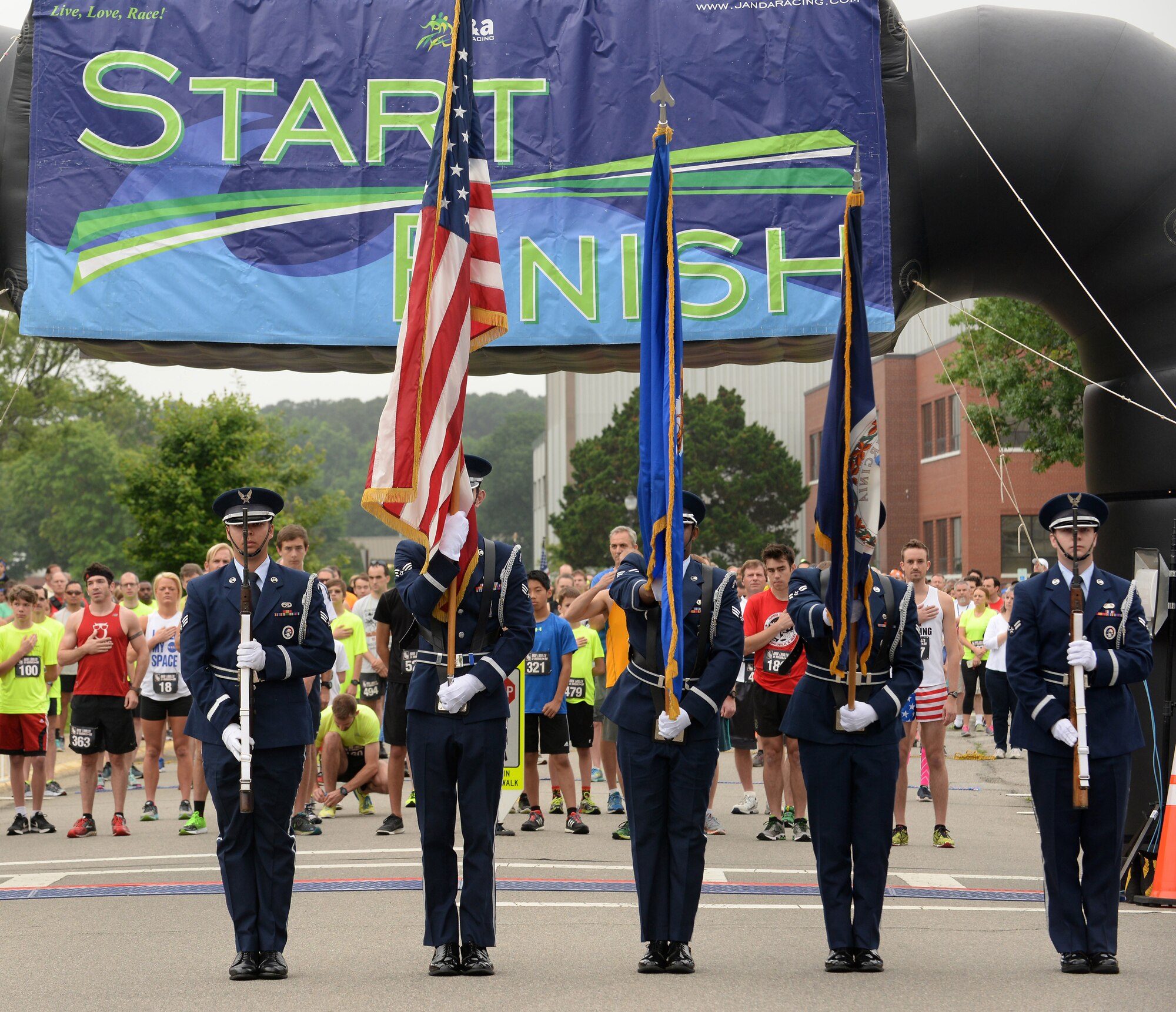 Members of the Langley Honor Guard present the colors before the 3rd annual NASA Langley Research Center Moonwalk and Run 5K at NASA LaRC, Va., June 4, 2016. NASA Langley hosted the event to promote and encourage a healthier and more active lifestyle for all NASA employees and their families. (U.S. Air Force photo by Staff Sgt. Teresa J. Cleveland)