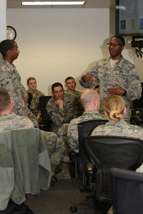 U.S. Air Force Airman 1st Class Christopher, cyberspace effects analyst for the 17th Intelligence Squadron, part of the 363rd Intelligence, Surveillance and Reconnaissance Wing, briefs fellow Airmen on cyberspace security threats at Langley Air Force Base, Va., May 24, 2016. The 363rd ISRW is the sole Air Force reach back targeting organization supporting counter-insurgency operations around the globe. (U.S. Air Force photo by Staff Sgt. Teresa J. Cleveland)