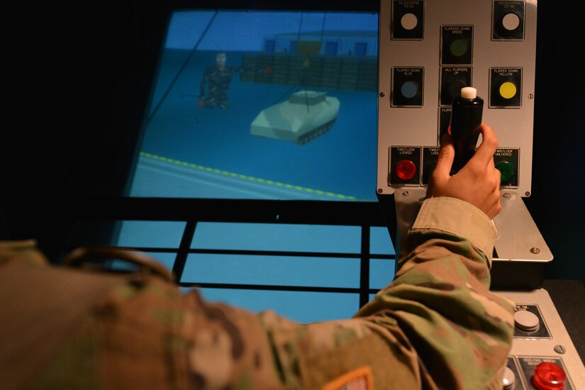 A U.S. Army Advanced Individual Training student operates a Haglin crane simulator at the Maritime and Intermodal Training Department Simulation Center on Fort Eustis, Va., May 31, 2016.  Students training on crane operations go through various simulators for hands-on practice before using live equipment. (U.S. Air Force photo by Staff Sgt. Natasha Stannard)