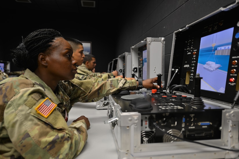 U.S. Army Pvt. Aleasha Stanley, an Advanced Individual Training student with the Maritime and Intermodal Training Department, operates an individual crane simulator at Fort Eustis, Va., May 31, 2016. The MITD trains maritime, cargo handling and rail operations to students using simulators before live training to reduce risks and costs. (U.S. Air Force photo by Staff Sgt. Natasha Stannard)