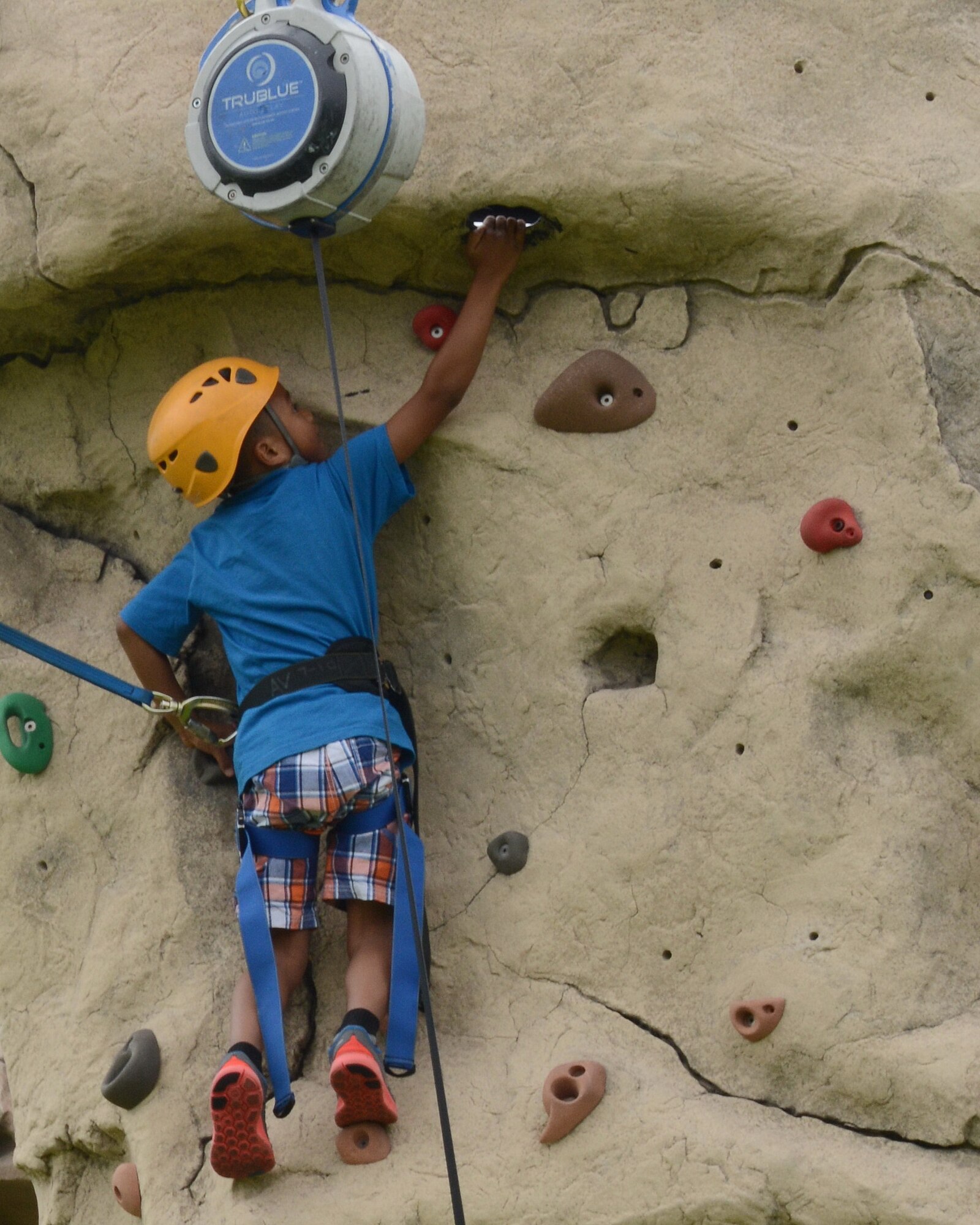 Outdoor Rec offers young outdoor enthusiasts a chance at rock climbing with Kidz Rock, a program that teaches the basics of rock climbing on ODR's climbing wall. Outdoor Recreation is offering several other summer children's programs, including kayak clinics, pool activities, brewery tours and more. (Photo by Jamie Burnett)