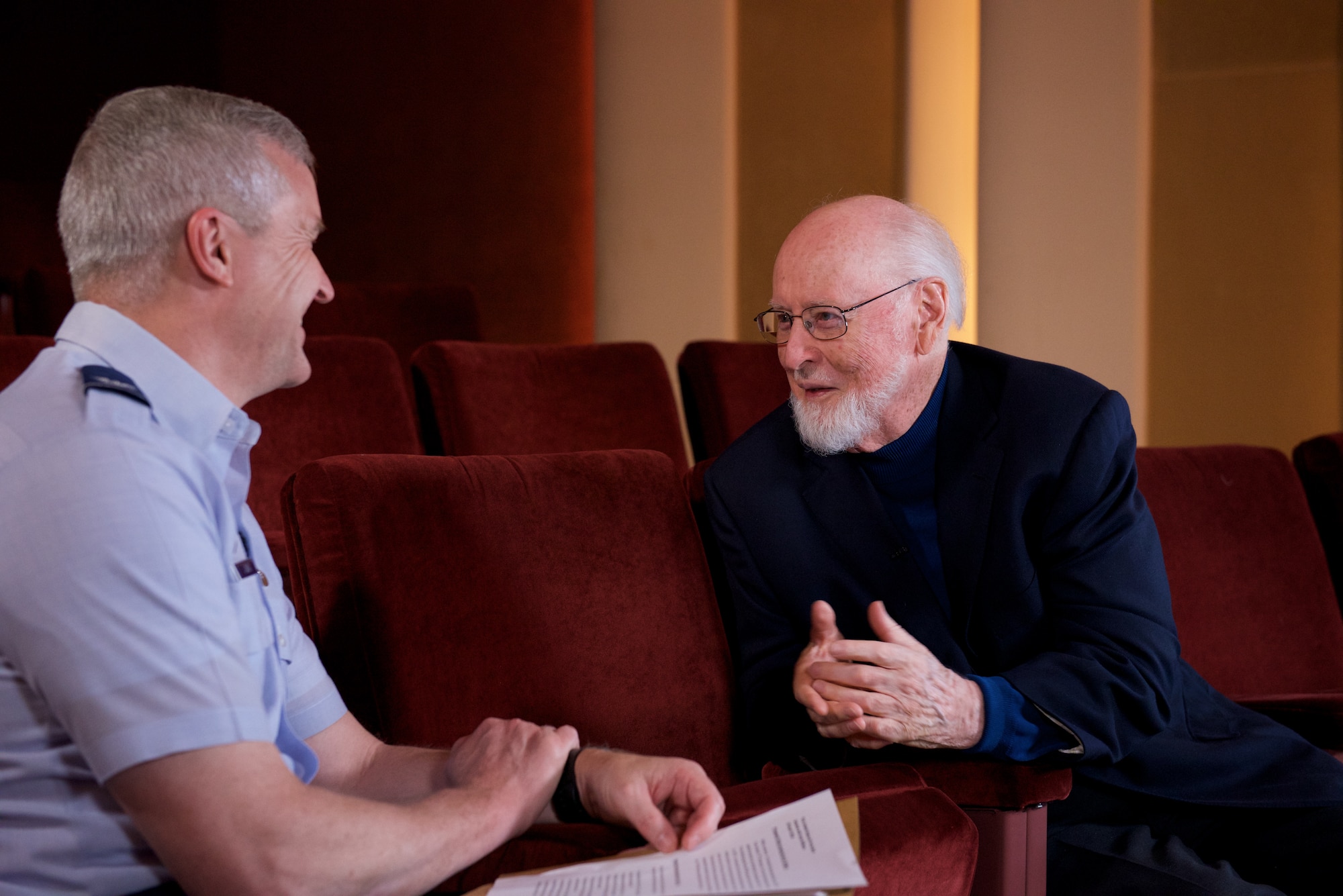 Legendary conductor and composer John Williams talks about his time in the U. S. Air Force with Col. Larry Lang, commander of the U.S. Air Force Band. Williams served as a pianist and brass player, arranging and writing as a secondary duty, though extensively. (U.S. Air Force Photo/CMSgt Bob Kamholz)