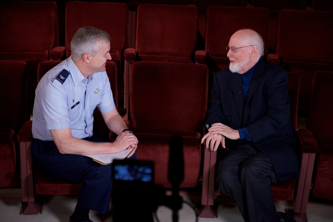 Col. Larry Lang, commander of the U.S. Air Force Band, interviews legendary conductor and composer John Williams about his time in the U. S. Air Force. Williams served as a pianist and brass player, arranging and writing as a secondary duty, though extensively. (U.S. Air Force Photo/CMSgt Bob Kamholz)