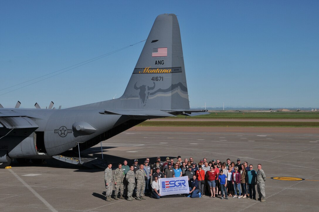 Participants of the Employer Support of the Guard and Reserve Boss Lift event assemble on the flight line before boarding C-130 Hercules cargo aircraft June 4, at the Great Falls International Airport. The program promotes cooperation and understanding between Reserve Component service members and their civilian employers. (U.S. Air National Guard photo/Technical Sgt. Michael Touchette)