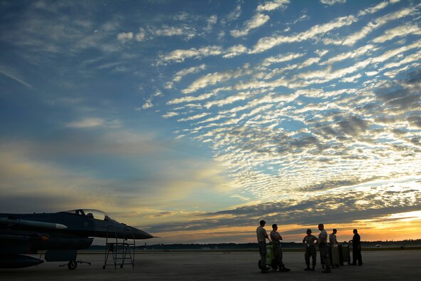 Airmen from the 115th Fighter Wing prepare for the first flight of the day at Tyndall Air Force Base, Fla., May 9, 2016. The 115 FW travelled to Tyndall AFB for a training exercise called Combat Archer which allowed pilots, maintainers and operations Airmen an opportunity to train with live missiles. (U.S. Air National Guard Photo by Senior Airman Kyle Russell)