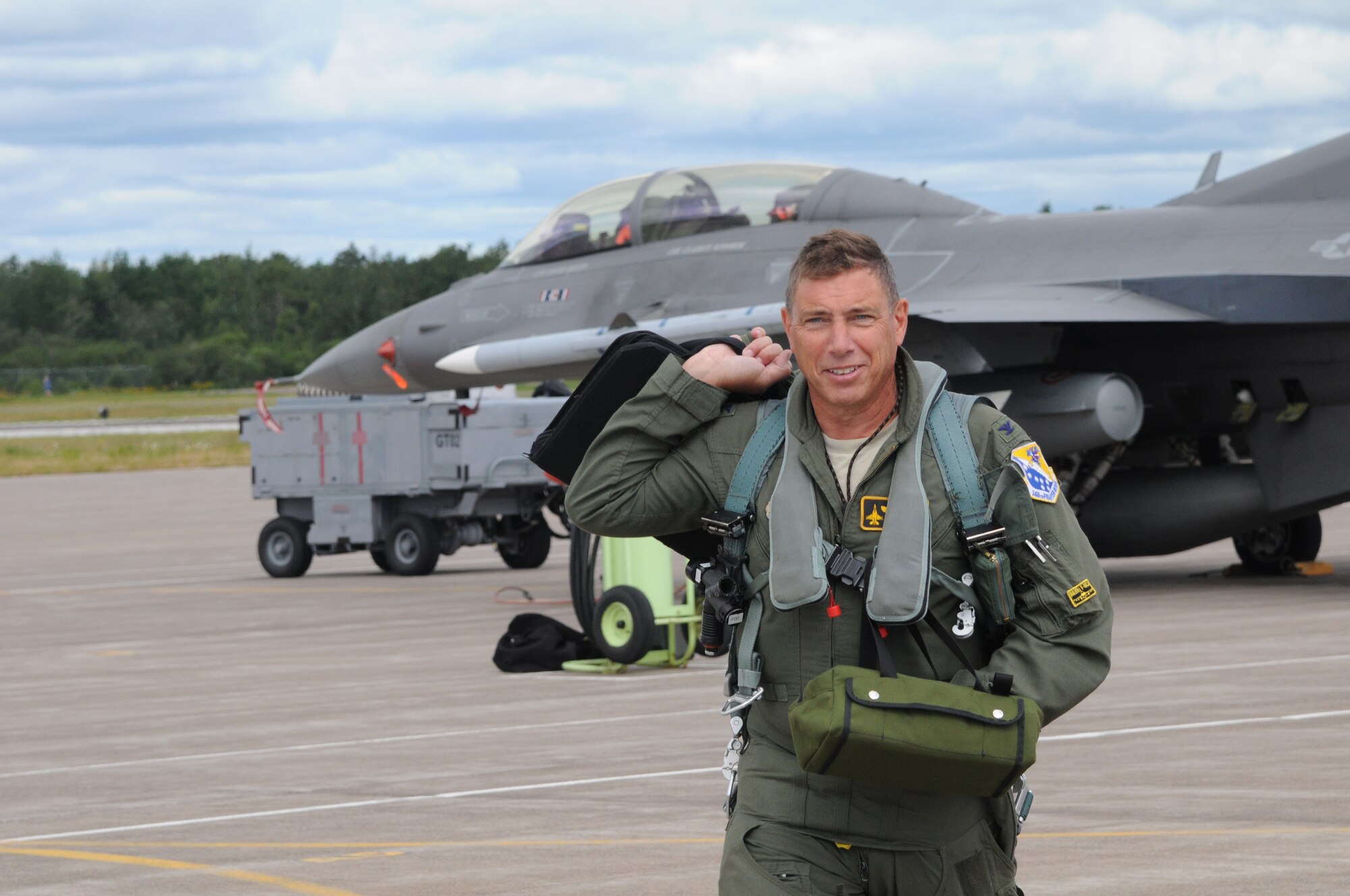 Brig. Gen. Frank H. Stokes walks across the ramp at the 148th Fighter Wing, Duluth, Minn. Aug. 3, 2015.  Stokes, former 148th Fighter Wing Commander, has been appointed to the role of Deputy Director of Regional Engagements for U.S. Africa Command (U.S. AFRICOM), stationed at United States Army Garrison Stuttgart, Germany.