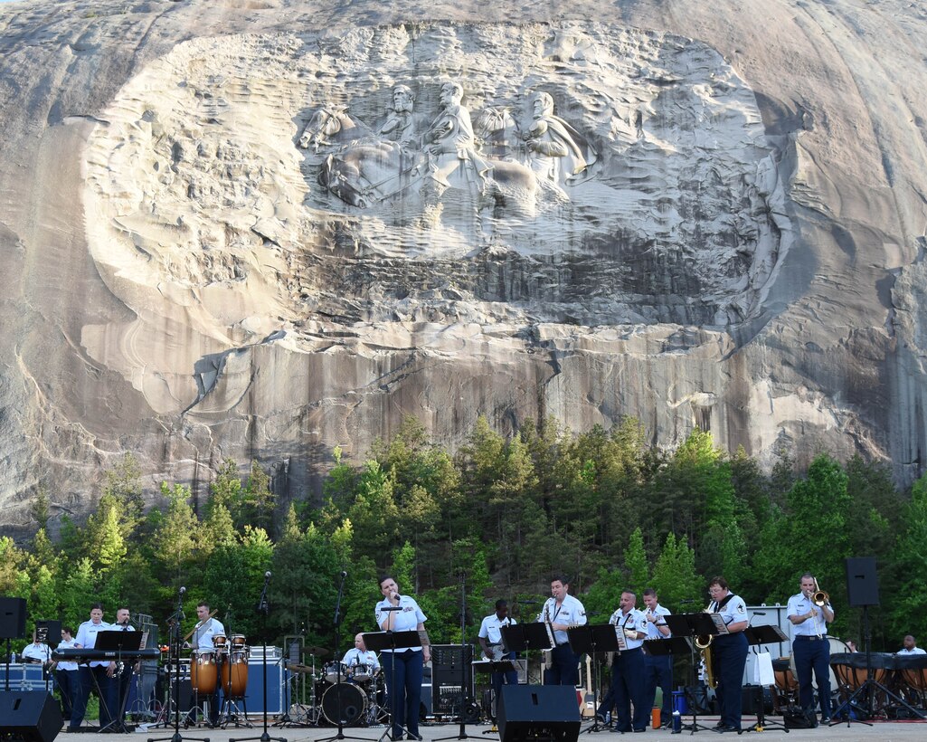 Tech. Sgt. Michelle Hoffman along with the Rock Band Sound Barrier, part of the Air National Guard Band of the South, entertain thousands at Stone Mountain Park in Atlanta, GA