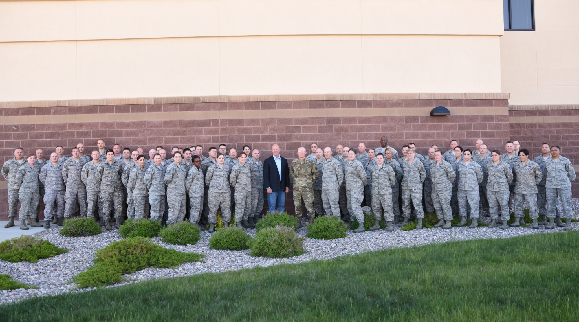 Deploying airmen from the 153rd Airlift Wing, Wyoming Air National Guard, pose for a photo with Wyoming Gov. Matt Mead and Wyoming Adjutant General, Maj. Gen. K. Luke Reiner June 5, 2016. Mead and Reiner made it a priority to talk with these airmen prior to their upcoming deployments. (U.S. Air National Guard photo by Senior Airman Nichole Grady)