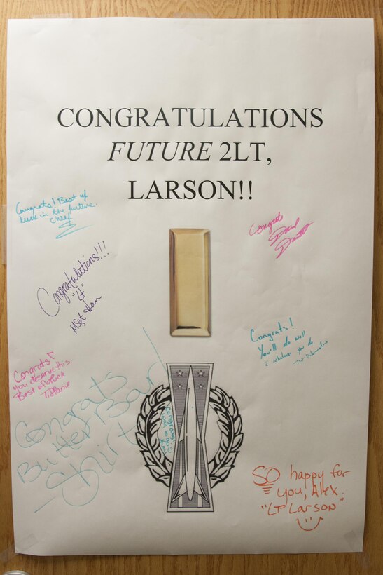 A congratulatory poster hangs on the door  of Staff Sgt. Alex Larson’s office, 90th Medical Operations Squadron flight and operations medicine technician, June 1, 2016, in the medical treatment facility at F.E. Warren Air Force Base, Wyo. Larson was selected to become an officer in his first-choice career field of nuclear missile operations. (U.S. Air Force photo by Senior Airman Jason Wiese)