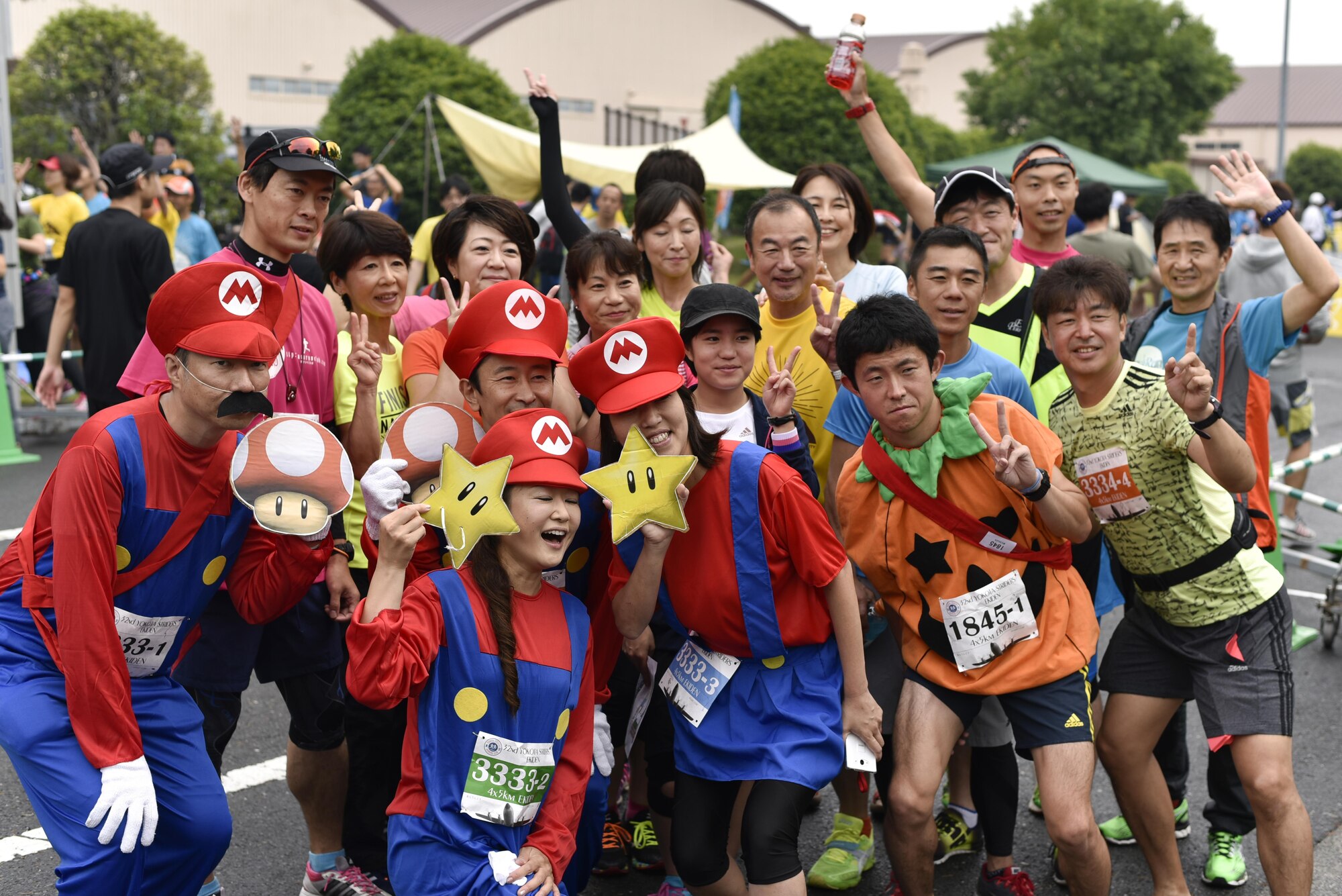 A group of Japanese runners prepare for their upcoming event during the 2016 Ekiden Run at Yokota Air Base, Japan, June 5, 2016. The 32nd Annual Ekiden Run was hosted by the Yokota Striders Running Club. (U.S. Air Force photo by Staff Sgt. Michael Washburn/Released)