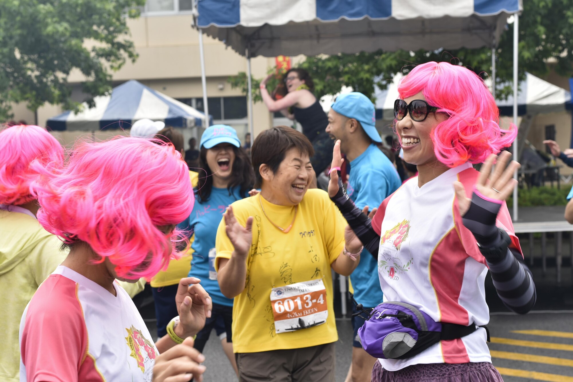 Japanese runners dance during the Zumba performance at the 2016 Ekiden Run at Yokota Air Base, Japan, June 5, 2016. Along with the Zumba demonstration, the Ekiden Run also had the Yokota Taiko Drummers, merchandise stands and food vendors. (U.S. Air Force photo by Staff Sgt. Michael Washburn/Released) 