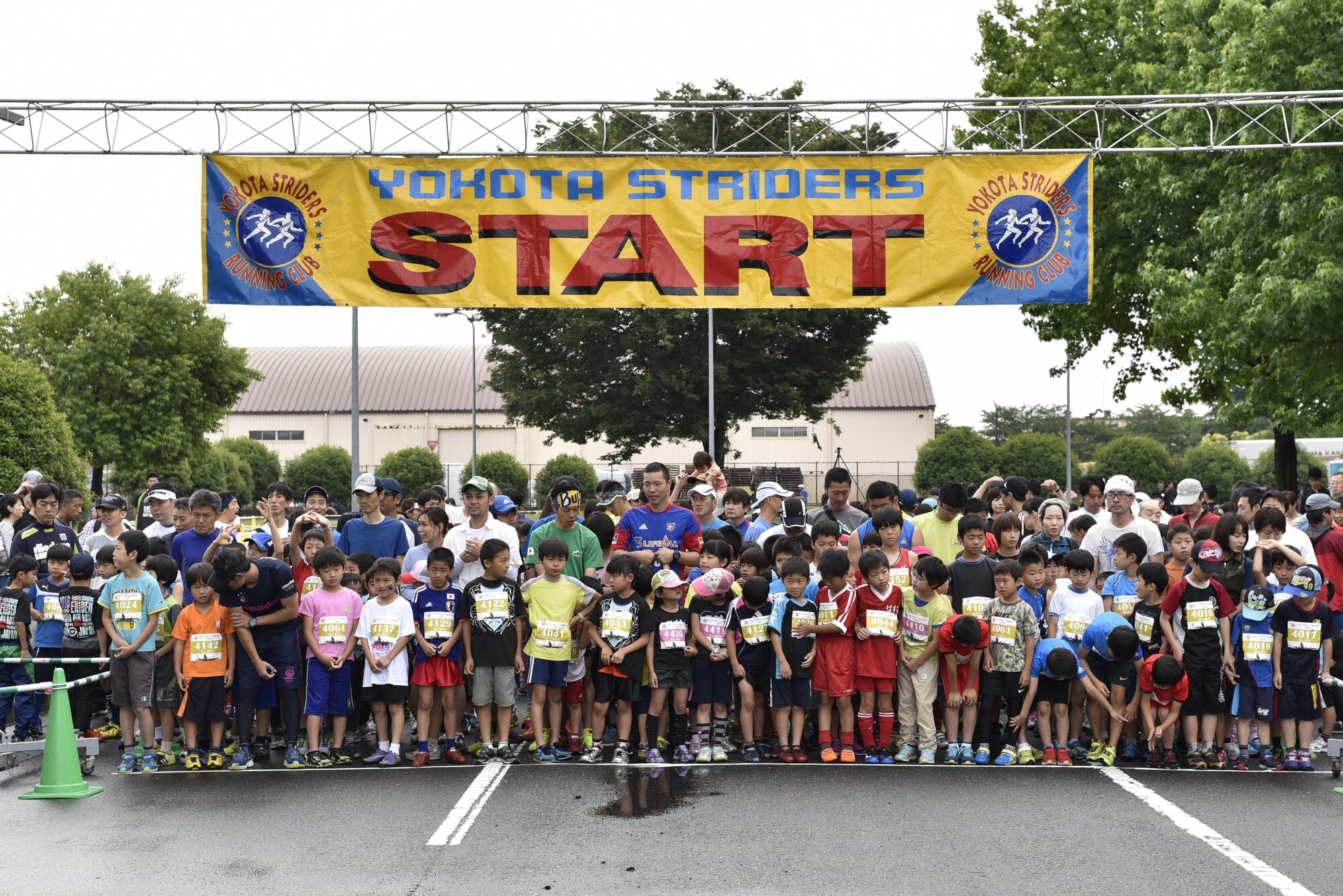 Runners line up for the kids 2k race during the 2016 Ekiden Run at Yokota Air Base, Japan, June 5, 2016. Japanese kids and adults of all ages visited Yokota to participate in the run. (U.S. Air Force photo by Staff Sgt. Michael Washburn/Released)